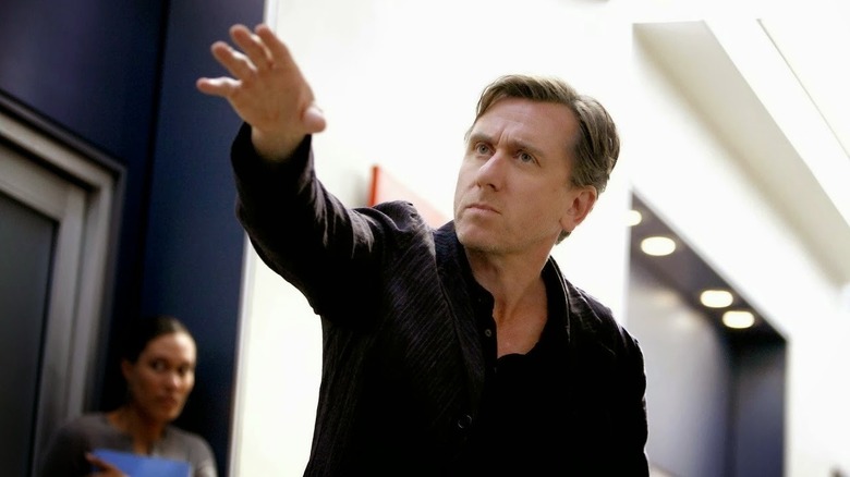 Cal Lightman (Tim Roth) holds up a hand seriously on Lie to Me