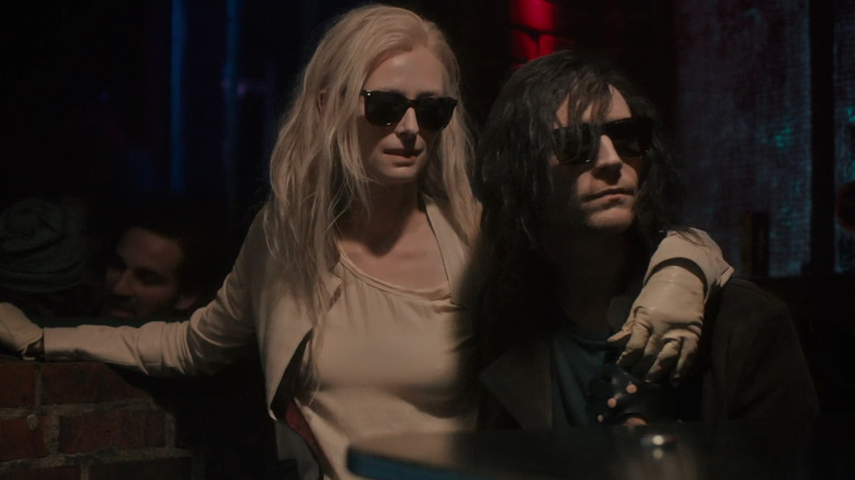 Eve (Tilda Swinton) and Adam (Tom Hiddleston) put their arms around each other while sitting at a bar in Only Lovers Left Alive (2013).