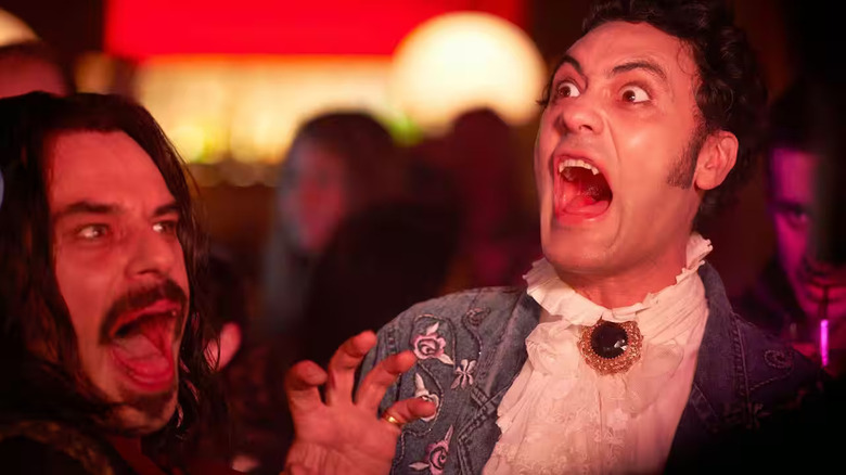 Viago and Vladislav his with their fangs out in the middle of the club in What We Do In The Shadows (2014).