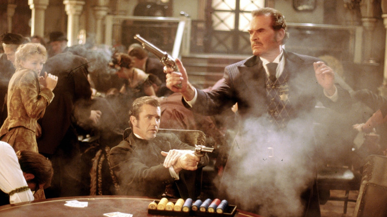 Bret Maverick (Mel Gibson) and Marshal Zane Cooper (James Garner) shoot guns in a casino in Maverick