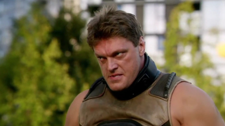 Adam Copeland's Atom Smasher staring and grimacing in The Flash