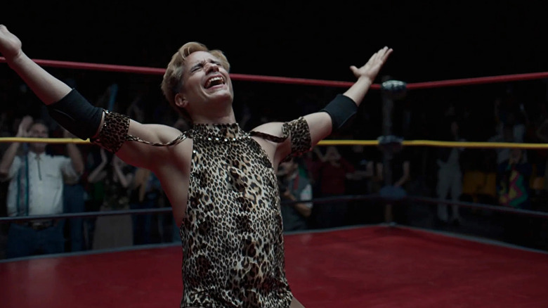 Cassandro (Gael García Bernal) raises his arms in Cassandro