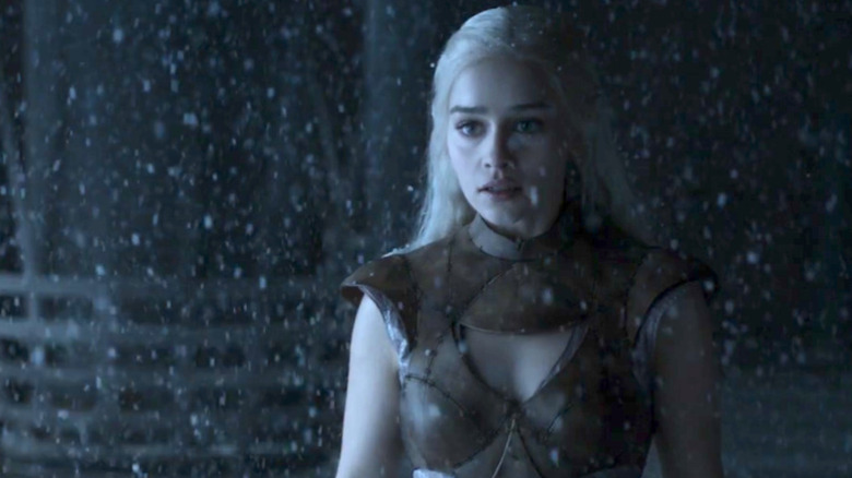 Emilia Clarke as Daenerys in a snowy Iron Throne room in Game of Thrones