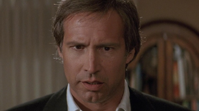Chevy Chase as Nick Halloway looks concerned in Memoirs of an Invisible Man