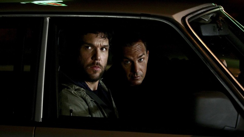 Dane Cook as Graves Baffert sits in a car next to Kevin Costner as Earl Brooks in Mr. Brooks