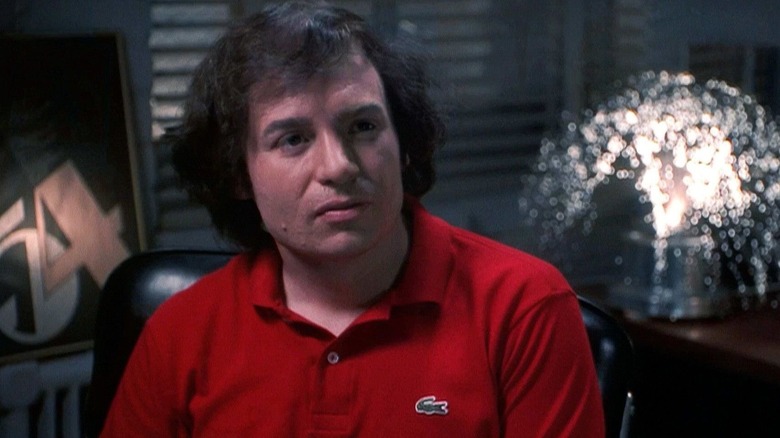 Mike Myers as Steve Rubell sits in an office in 54