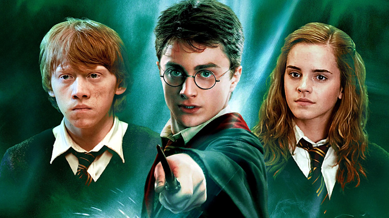 Rupert Grint as Ron Weasley, Danielle Radcliffe as Harry Potter, and Emma Watson as Hermione Granger