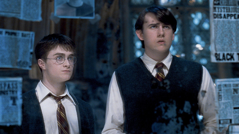 Danielle Radcliffe as Harry Potter stands next to Matthew Lewis in Harry Potter and the Order of the Phoenix