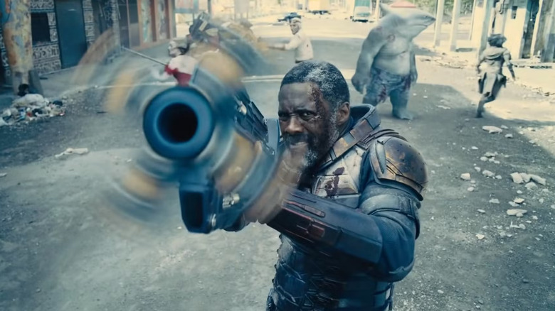 Bloodsport/Robert DuBois (Idris Elba) powers up a gun in The Suicide Squad.