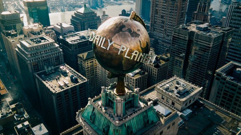 The top of The Daily Planet headquarters featuring a golden Earth with the words "The Daily Planet" around it in James Gunn's Superman.