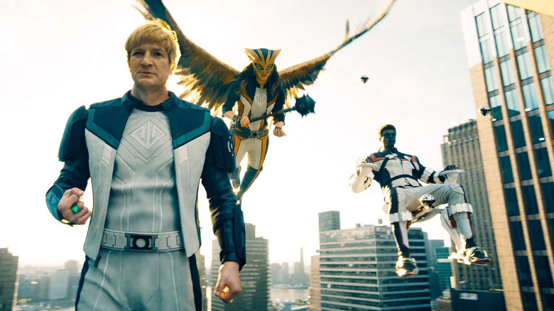 The Justice Gang of James Gunn's Superman -- (L-R) Guy Gardner (Nathan Fillion), Hawkgirl (Isabela Merced), and Mr. Terrific (Edi Gathegi) -- floating in the sky of Metropolis.