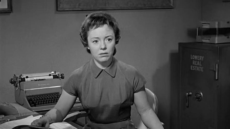 Caroline (Patricia Hitchcock) sitting at her desk in Psycho