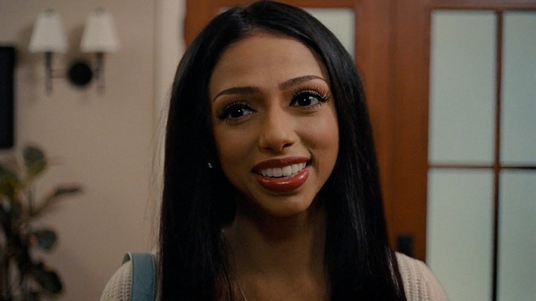 Lady Raven (Saleka Night Shyamalan) smiling in Trap