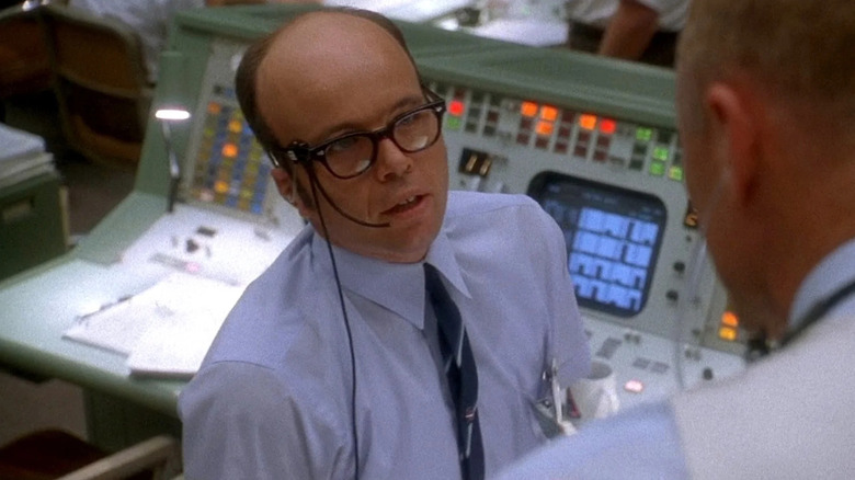 Sy Liebergot (Clint Howard) wearing glasses in Apollo 13
