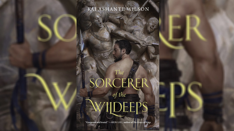 Sorcerer of the Wildeeps demane stands with spear against statues