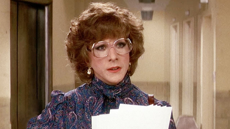Dorothy Michaels (Dustin Hoffman) holding a script in Tootsie (1982).