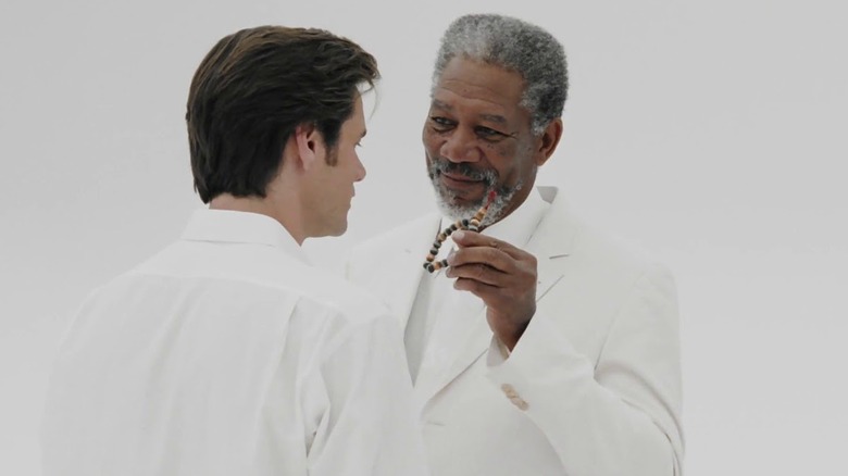 God (Morgan Freeman) hands Bruce (Jim Carrey) a bracelet of prayer beads in Bruce Almight (2004).