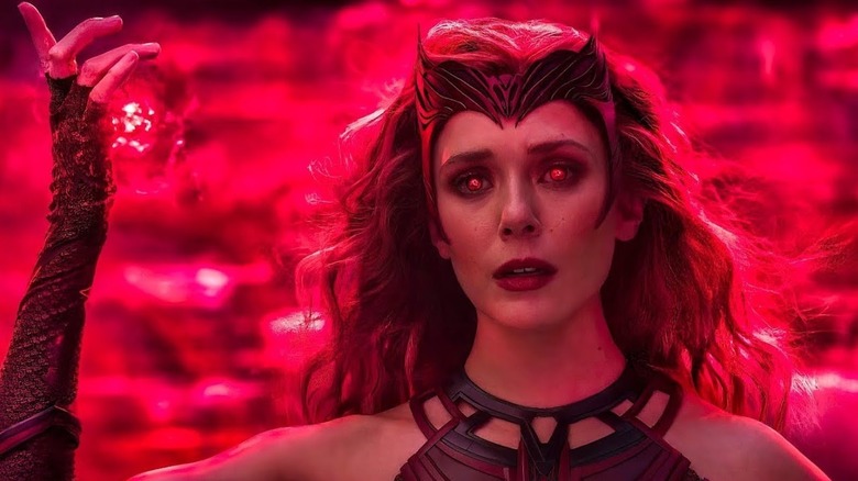 Scarlet Witch (Elizabeth Olsen) prepares a glowing red spell in Doctor Strange in the Multiverse of Madness