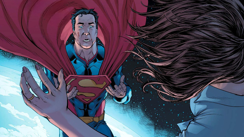 Superman looks at Lois Lane's corpse in horror