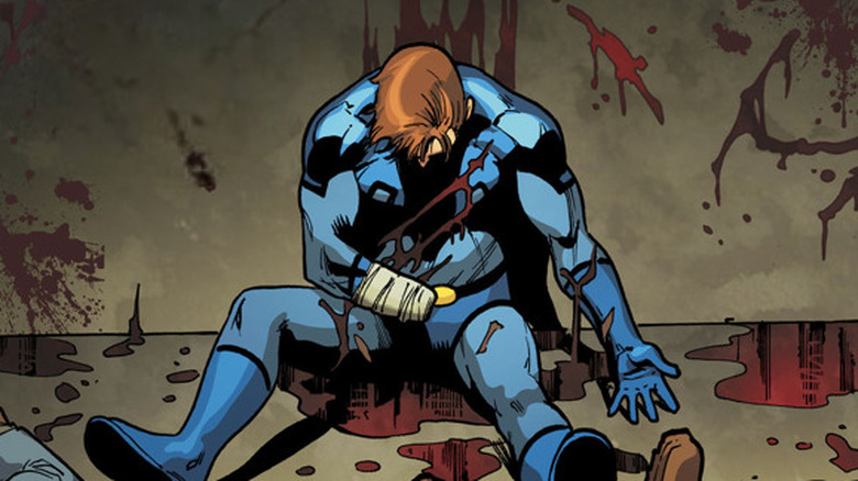 Ted Kord maimed on the floor