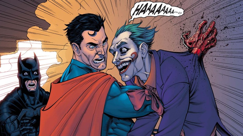 Superman punches a hole through Joker's chest while Batman watches