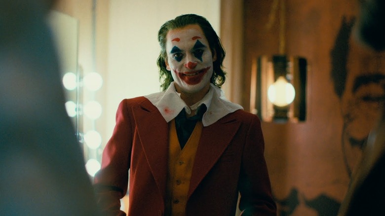 Joaquin Phoenix as Arthur Fleck, dressed as the Joker in Joker.