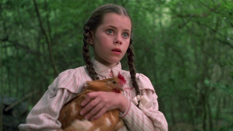 Fairuza Balk as Dorothy holding her chicken Billina in Return to Oz