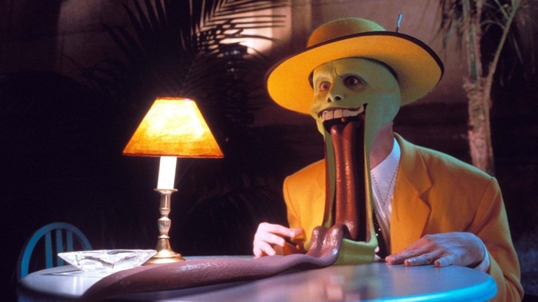The Mask (Jim Carrey) with his mouth fully agape and his tongue rolled out in The Mask