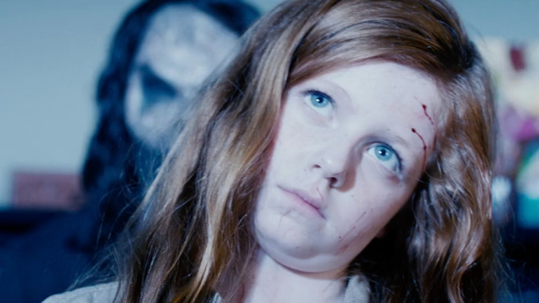 Bughuul (Nicholas King) appearing behind Ashley (Clare Foley) in Sinister