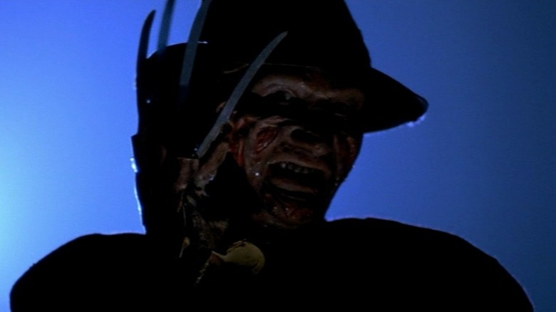 Freddy Krueger (Robert Englund) bearing his claws in A Nightmare on Elm Street