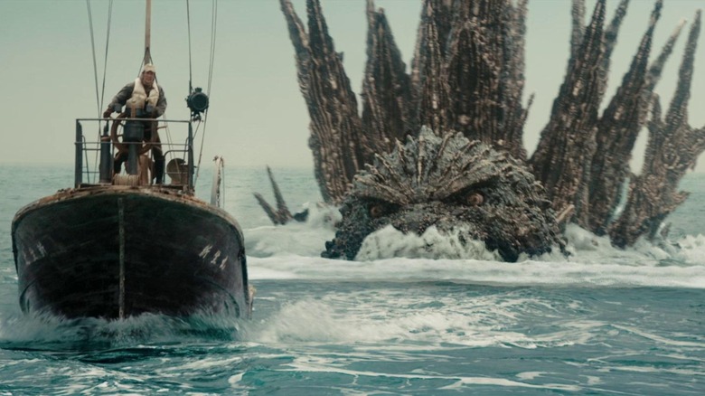 Godzilla chasing after a boat in Godzilla Minus One