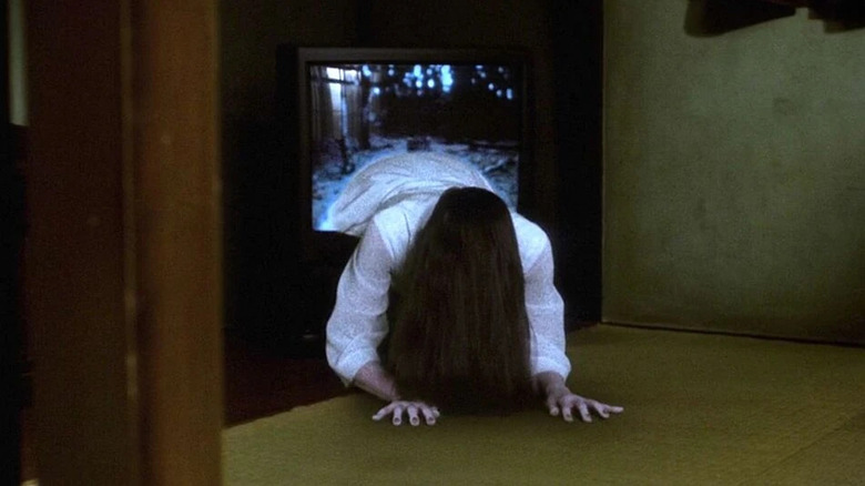 Sadako Yamamura (Rie Inō) crawling out of TV in Ringu