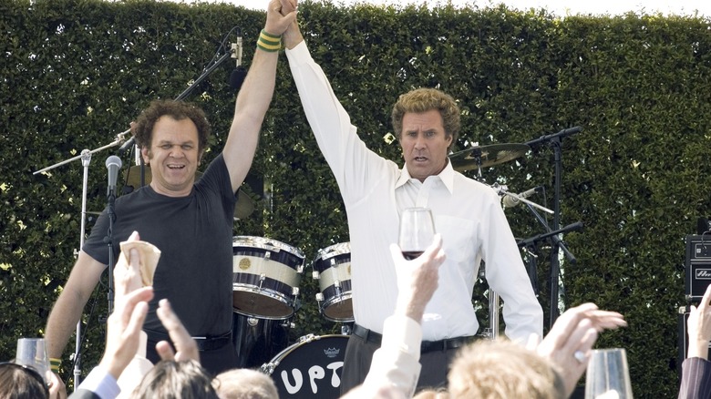 Will Ferrell and John C. Reilly as Dale and Brennan holding hands in triumph at the Catalina Wine Mixer in Step Brothers