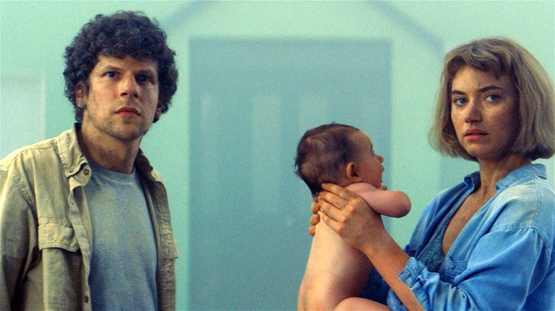 Imogen Poots holding baby next to Jesse Eisenberg