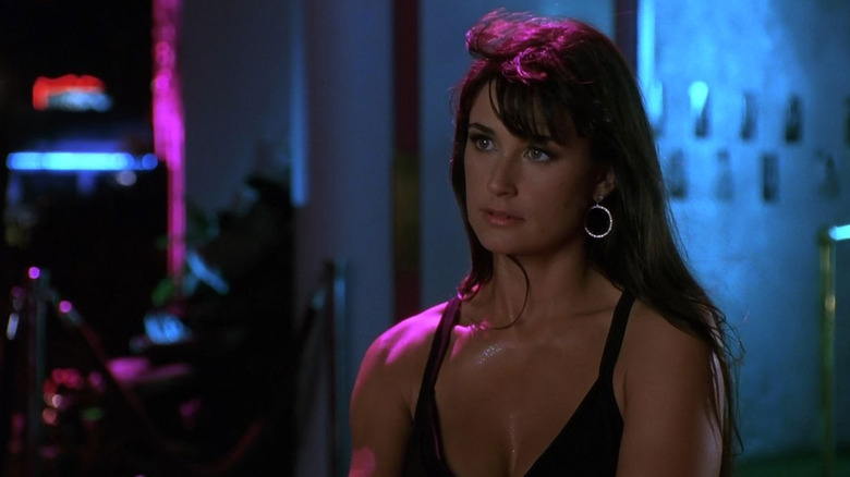 Demi Moore as Erin sweaty in a bikini in Striptease