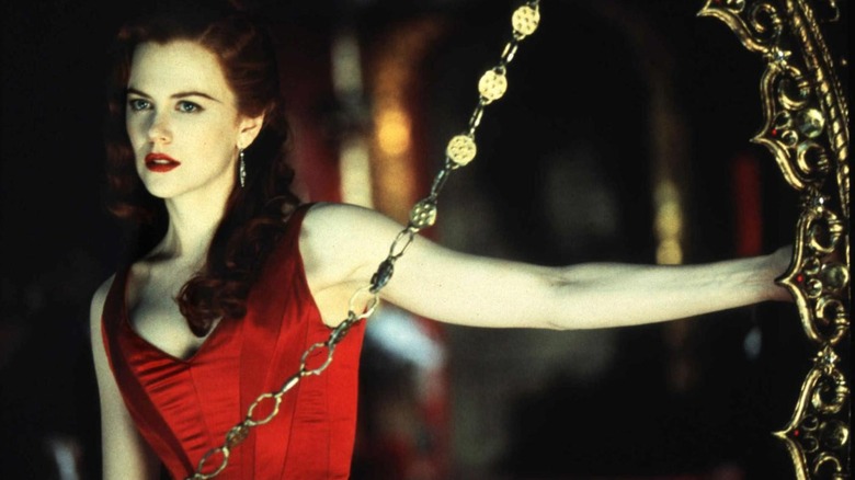 Satine (Nicole Kidman) stares off into a dark distance in Moulin Rouge