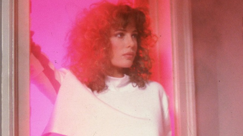 Kelly LeBrock as Lisa, wearing a crop top, uses her beauty well in Weird Science