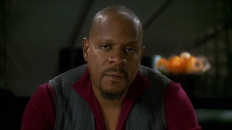 Benjamin Sisko (Avery Brooks) looks somberly at the camera in Star Trek: Deep Space Nine