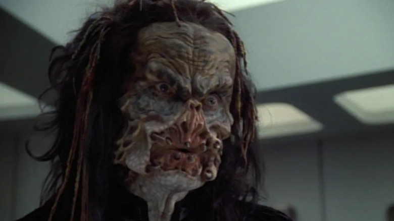 Treen (Terrence Evans) stands with his gaping maw in Star Trek: Voyager