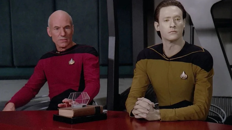 Jean-Luc Picard (Patrick Stewart) and Data (Brent Spiner) sit together at table in Star Trek: The Next Generation