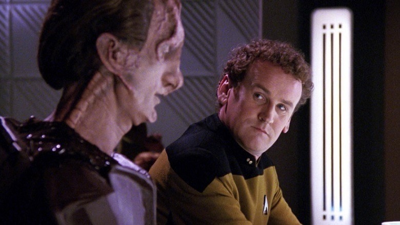 Miles O'Brien (Colm Meaney) glances at a Glinn Daro (Time Winters) in Star Trek: The Next Generation