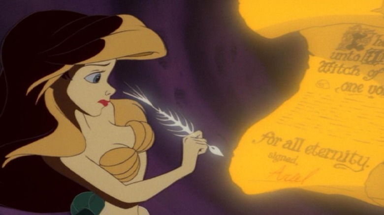 Jodi Benson as Ariel prepares to sign a contract in The Little Mermaid