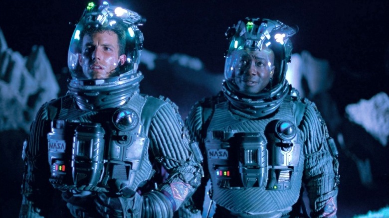 Ben Affleck as AJ stands next to Michael Clarke Duncan as Bear in Armageddon