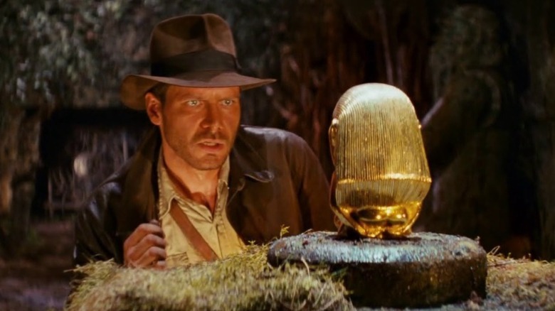 Indiana Jones looking at idol