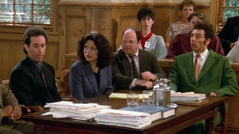 Jerry Seinfeld, Julia Louis-Dreyfus, Jason Alexander, and Michael Richards as Jerry, Elaine, George, and Kramer in a courtroom in the Seinfeld finale