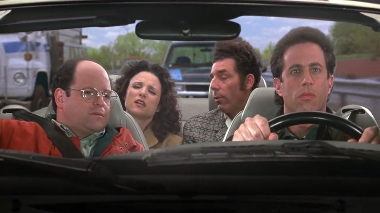 Jason Alexander, Julia Louis-Dreyfus, Michael Richards, and Jerry Seinfeld as George, Elaine, Kramer, and Jerry in a car in Seinfeld