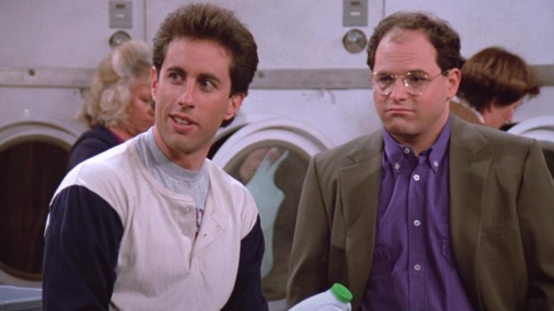 Jerry Seinfeld and Jason Alexander as Jerry and George in a laundromat in the Seinfeld pilot