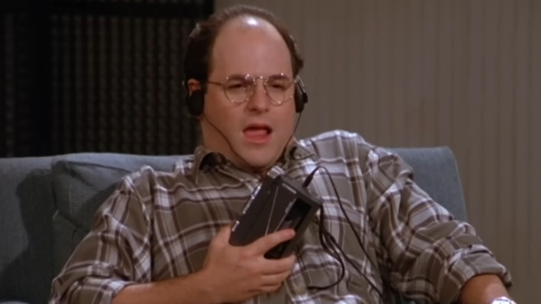 George (Jason Alexander) listening to a recording on Seinfeld