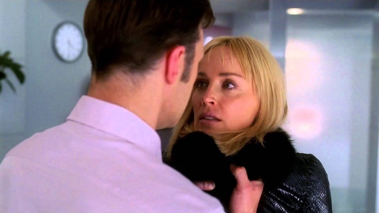 Michael Glass (David Morrissey) grabs the collar of Catherine Tramell (Sharon Stone) in Basic Instinct 2