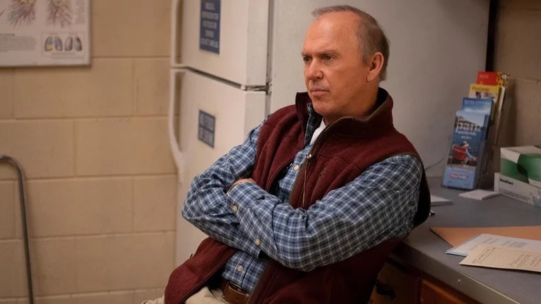 Michael Keaton sitting arms crossed